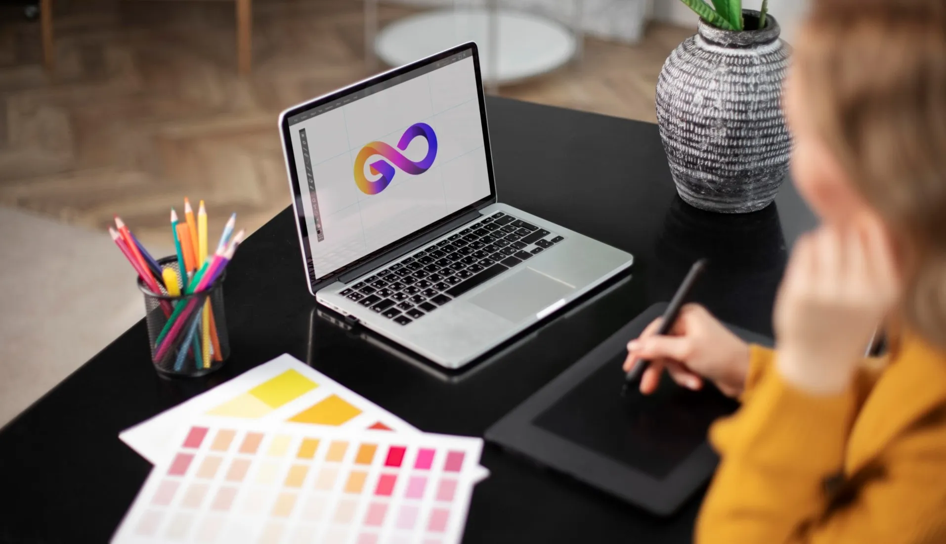 Creative laptop workspace showing 2025 graphic design trends for branding and visuals
