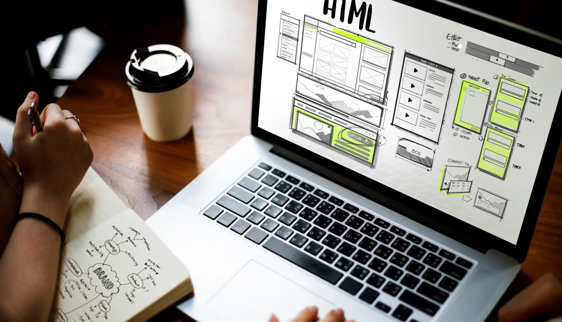 HTML wireframe on laptop highlighting the benefits of working with a creative design agency